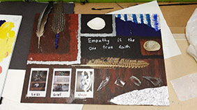 Mixed media artwork bearing the words 'Empathy is the one true faith'